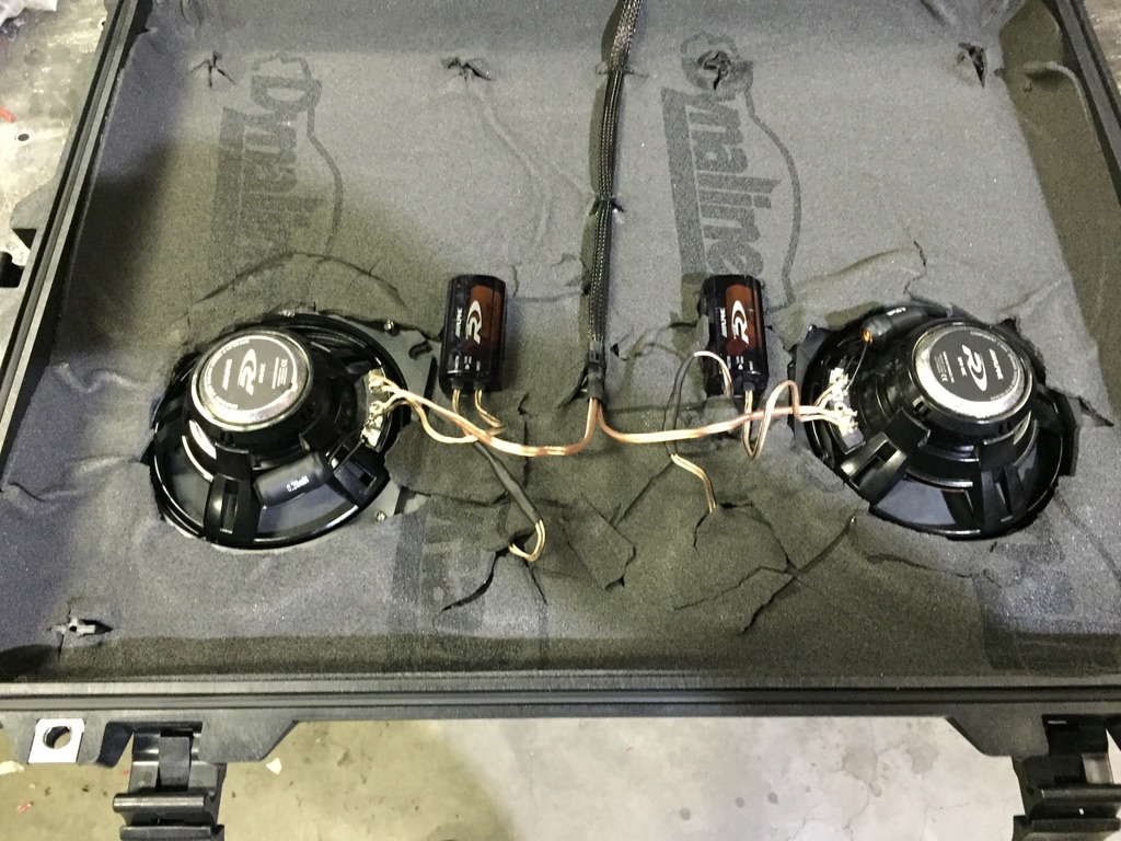 Back of speaker mounting panel showing two Alpine woofers, crossovers, copper wiring, Dynamat
