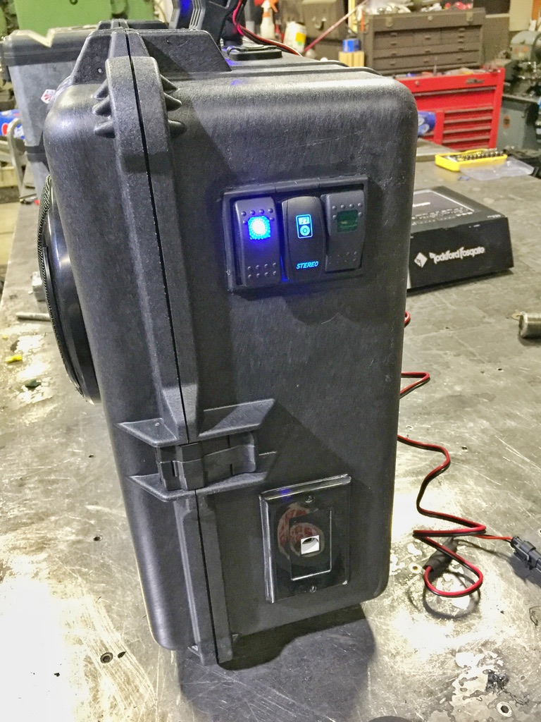 Marine-grade illuminated rocker switches glowing blue with STEREO label