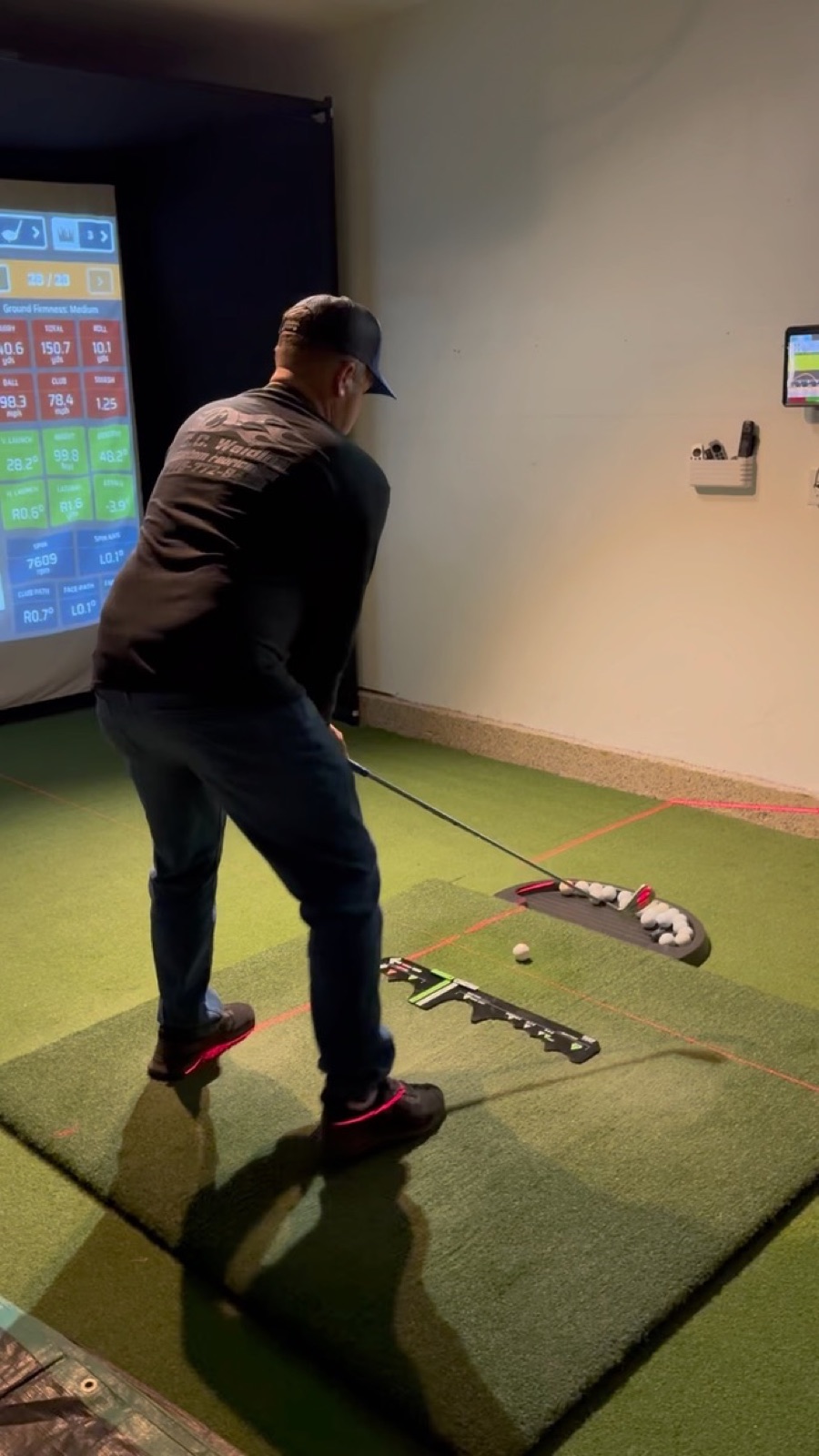 V2 player at tee box with stats display