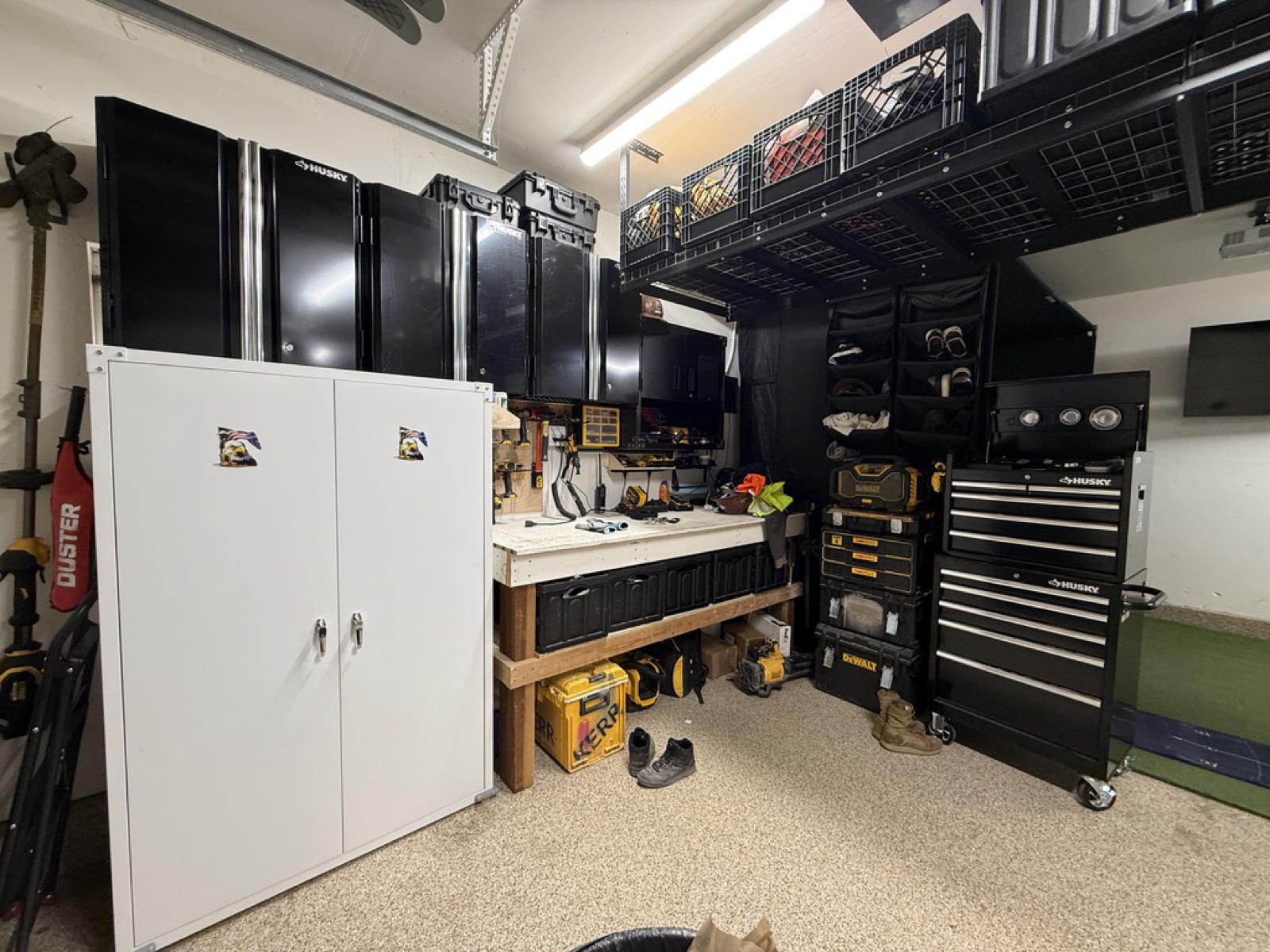 Workshop wall final cinematic — Husky cabinets, white storage, workbench with pegboard, DeWalt stack, Husky tool chest, clubs hanging