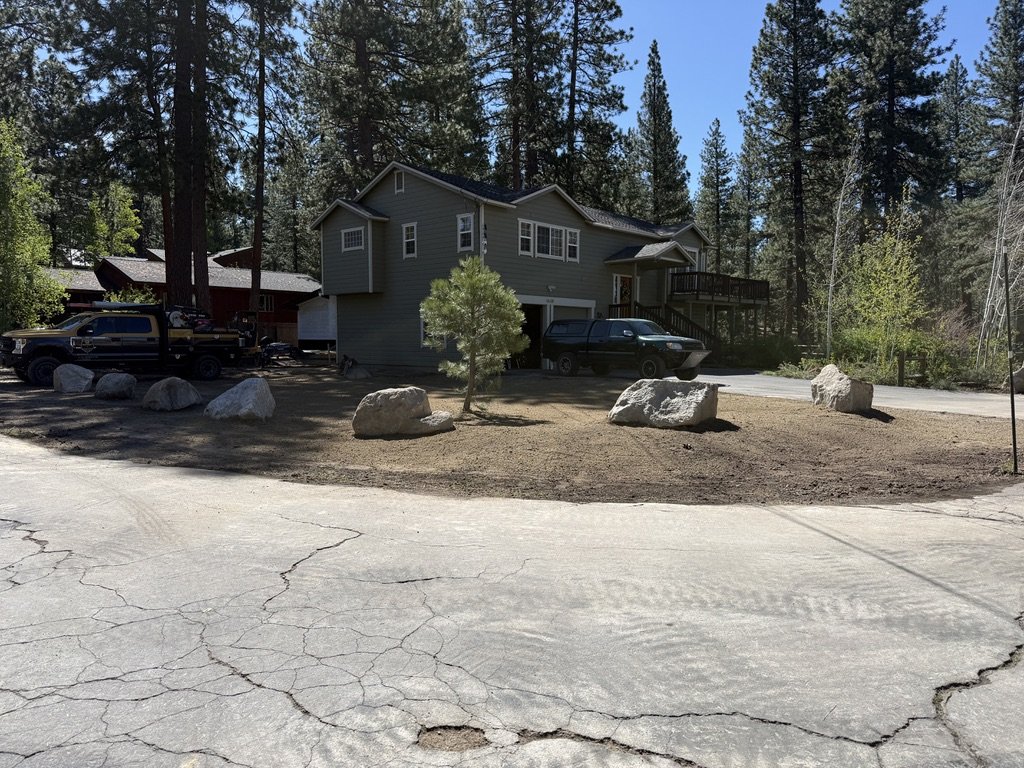 Mid-grading, the feature taking shape with paths and boulders integrated