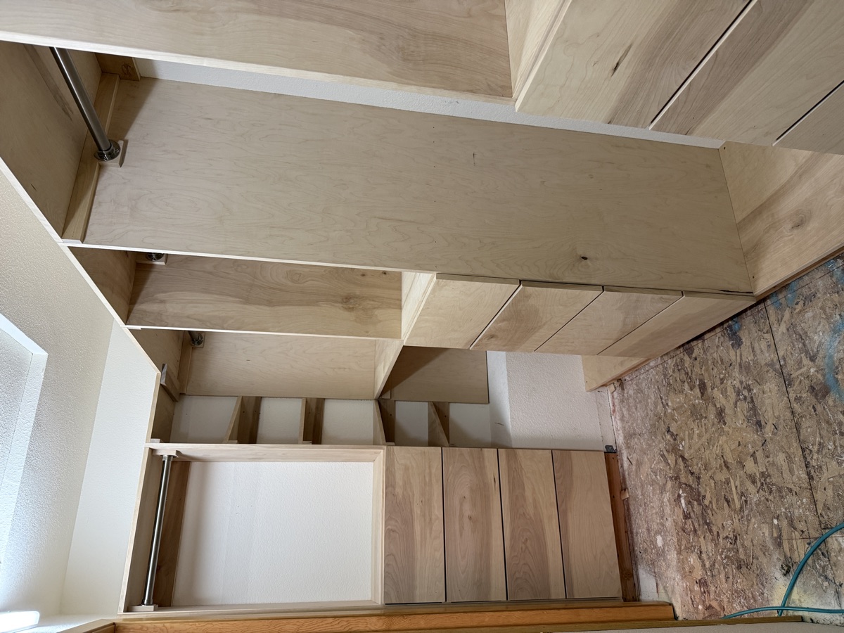 Completed walk-in closet with all built-ins, LED lighting, and organized storage