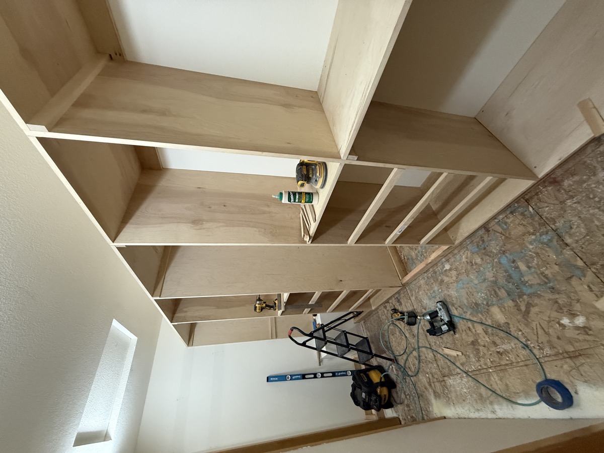 Completed walk-in closet system with all shelves and cubbies