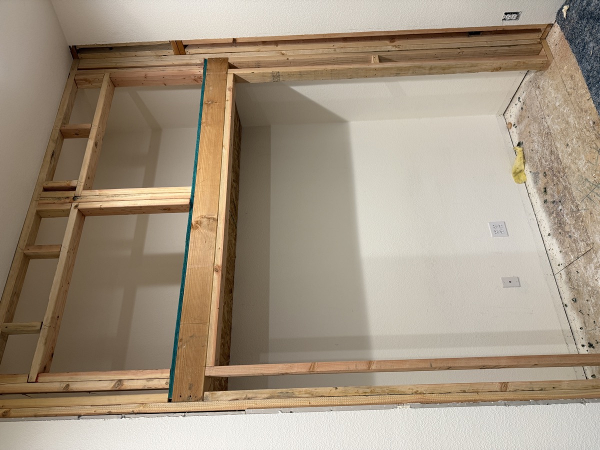 Structural wall framing exposed with studs on layout