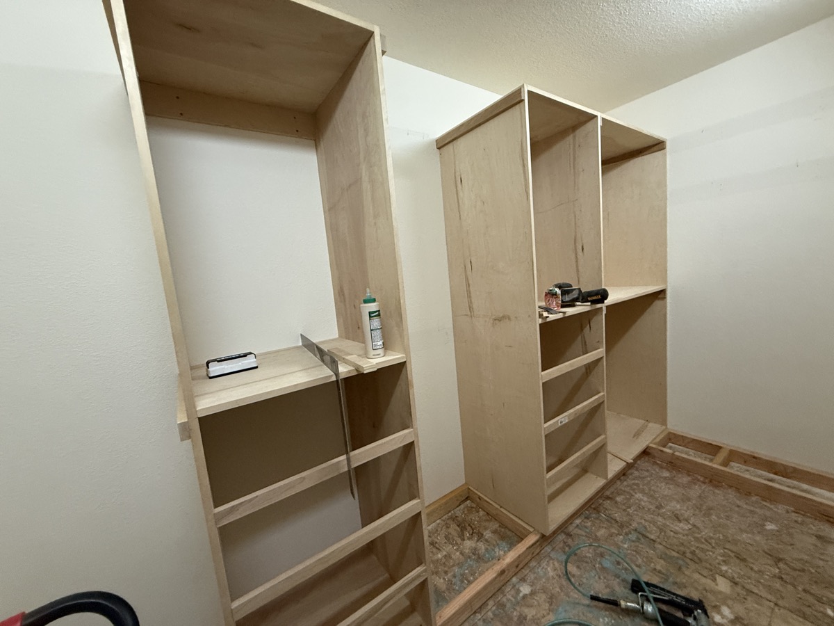 Second angle of installed closet built-ins with plywood towers