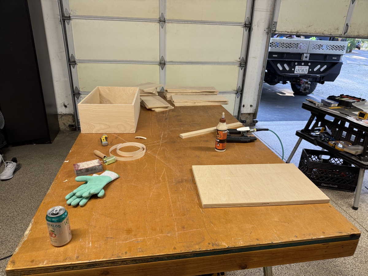Multiple cabinet boxes on the workbench being built
