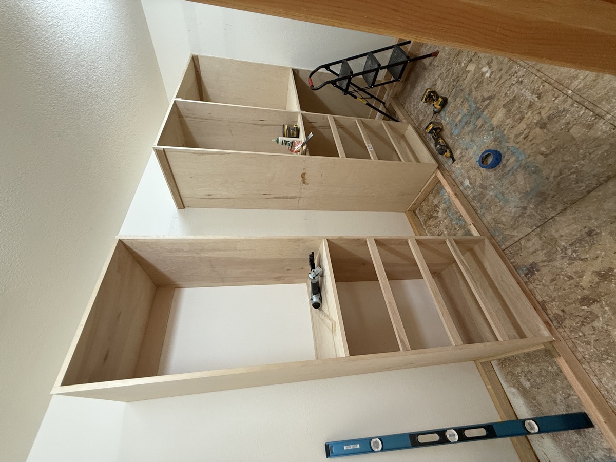 Walk-in closet mid-install with towers being set