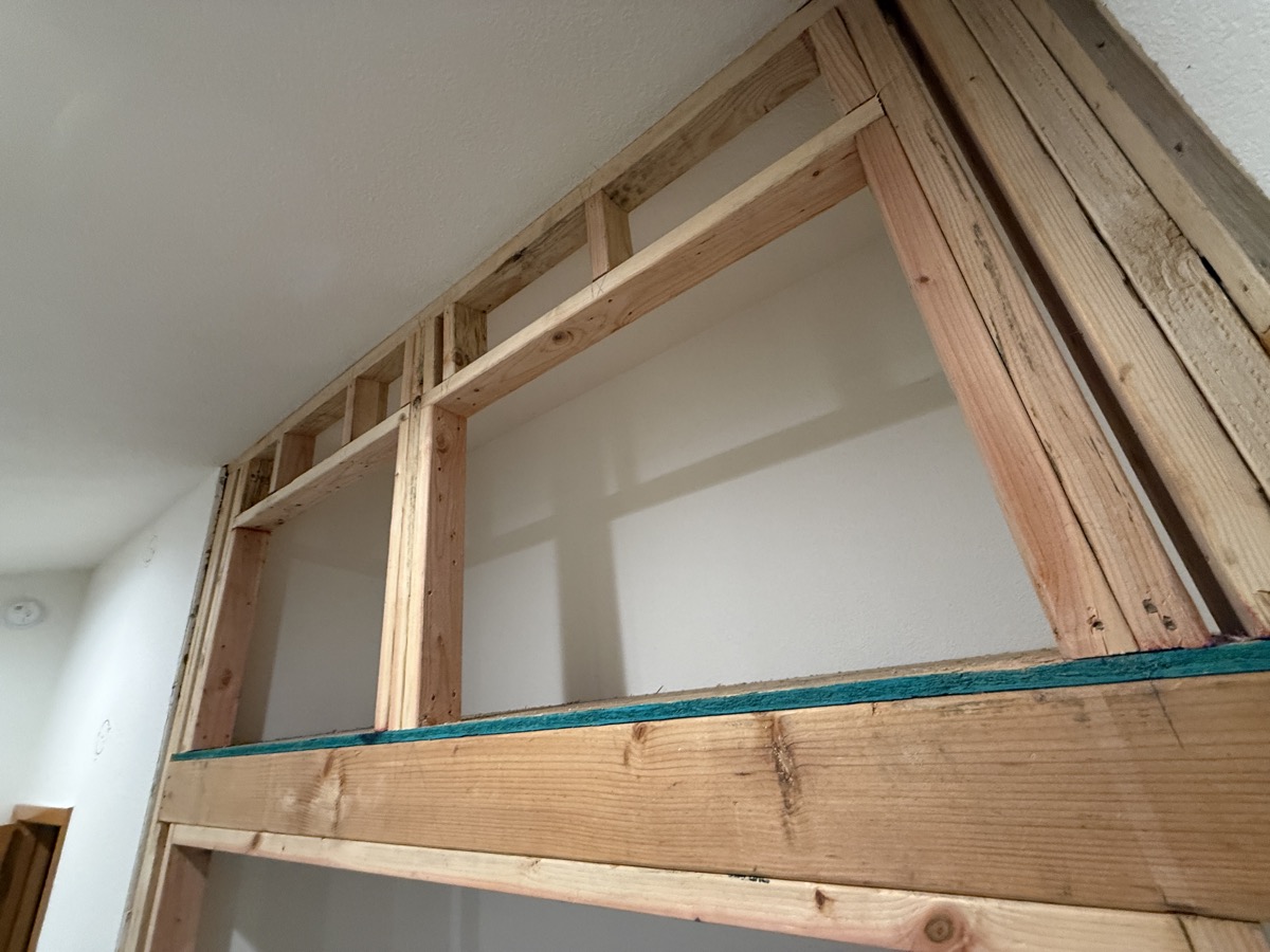 Exposed plywood subfloor in the eave space
