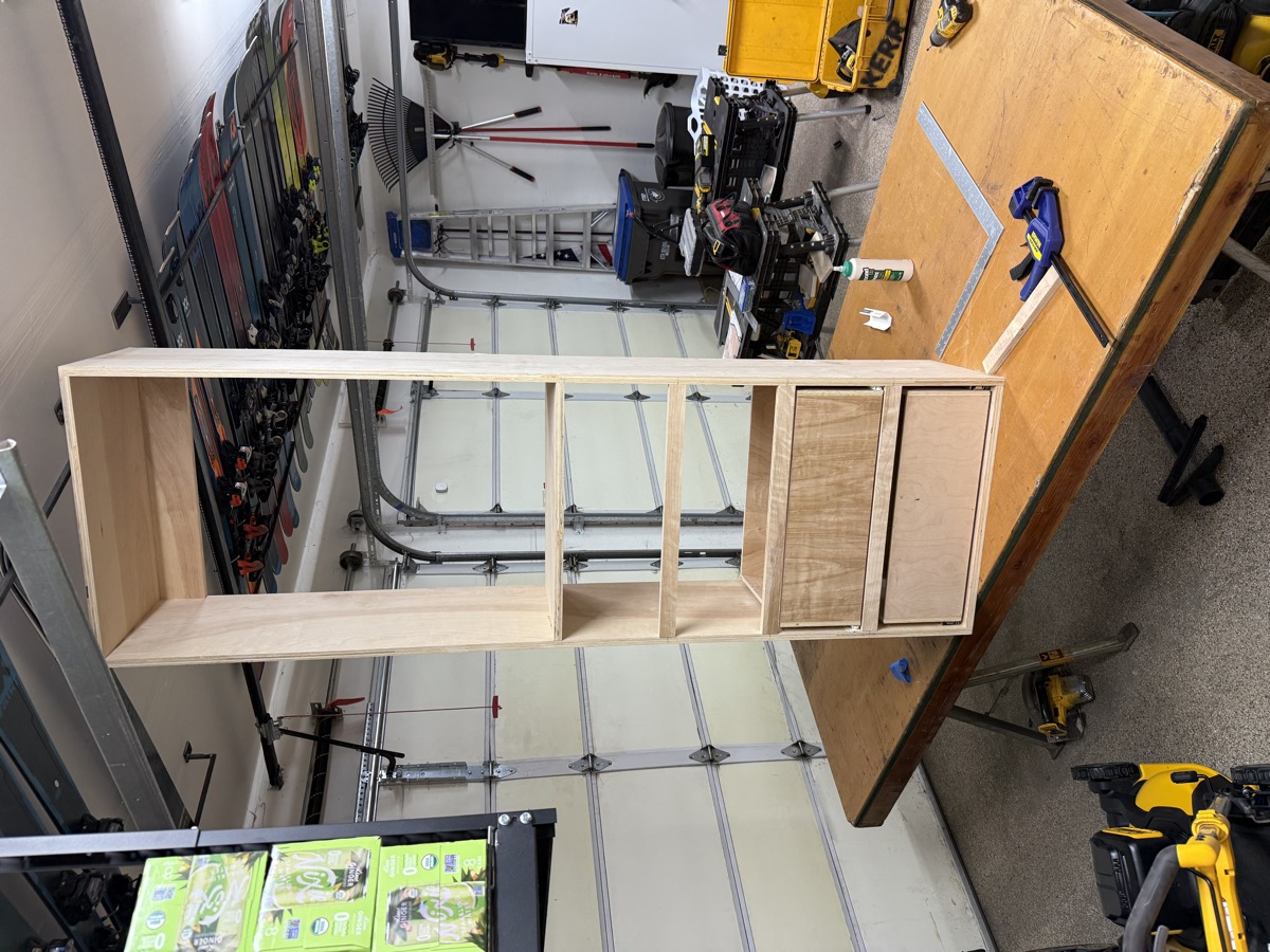 Finished shelving tower standing upright in the garage before install
