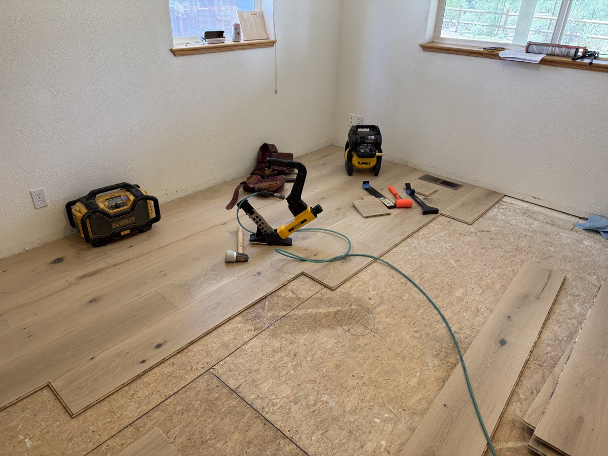 First courses of hardwood set to the chalk reference line