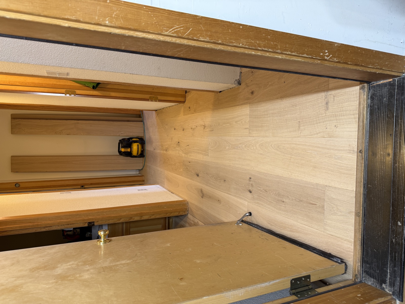 Hardwood flooring fitted inside closet alcove showing threshold transition detail